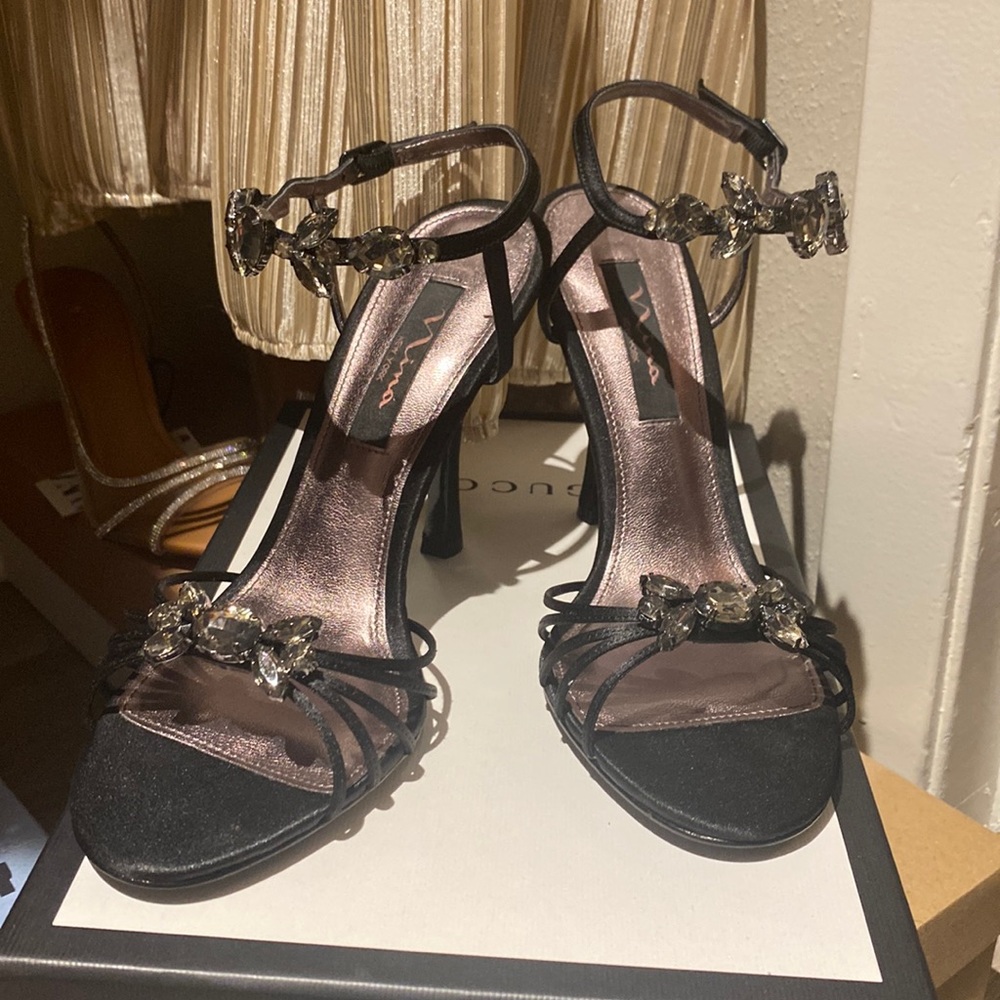 Black bejeweled heels by Nina